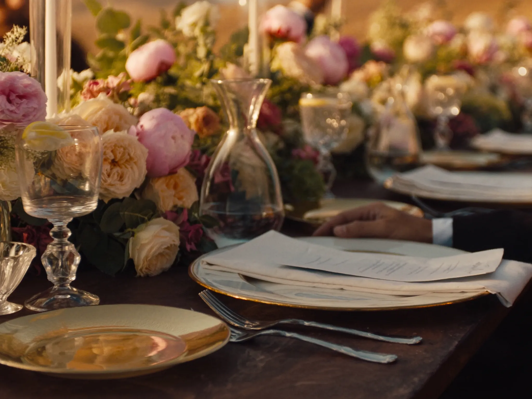 An intimate tablescape set with candlelight at dusk