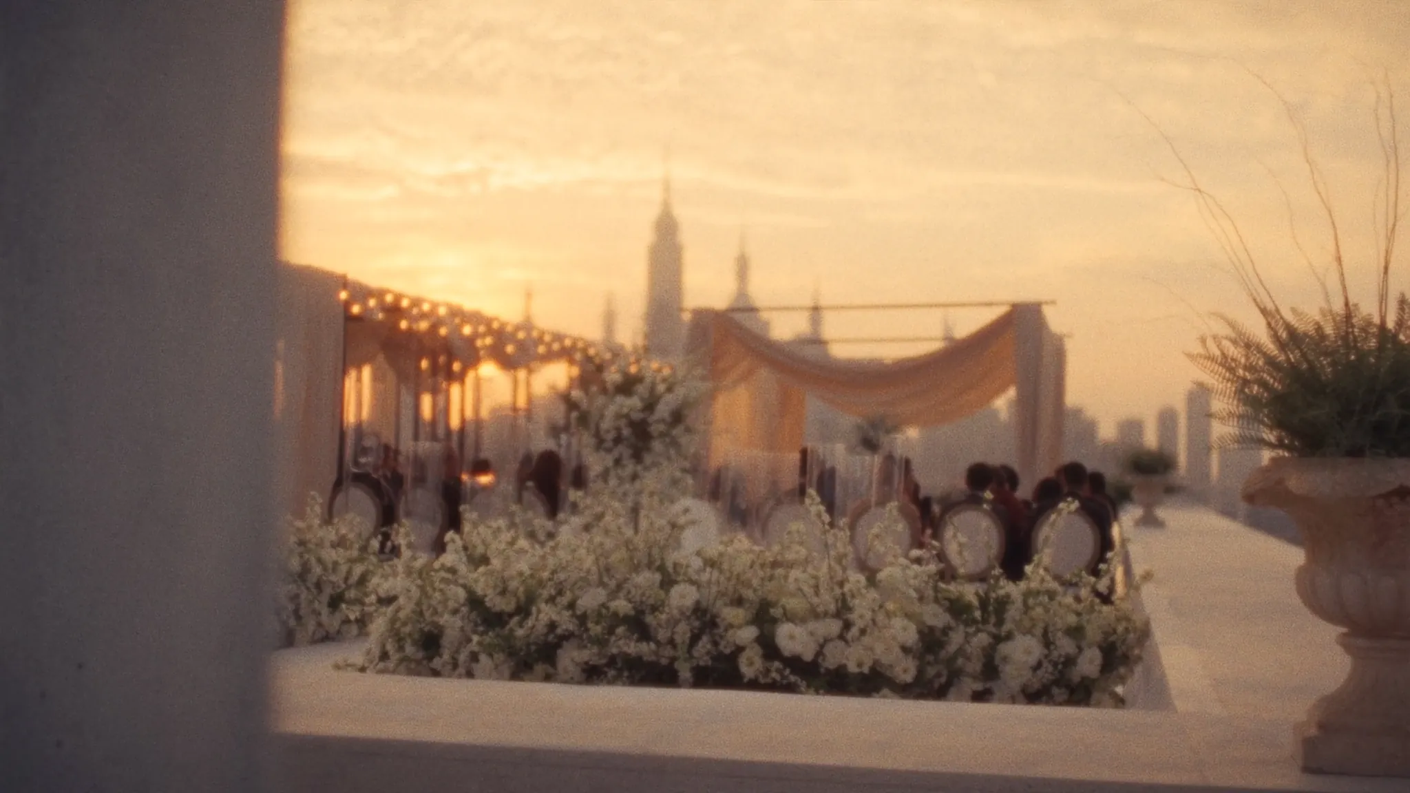 Rooftop terrace dressed for a celebration at golden hour